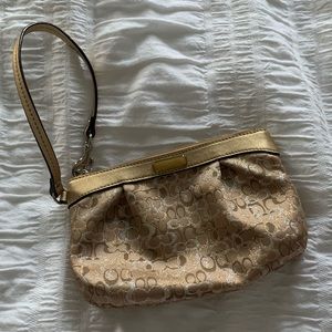 Gold coach wristlet
